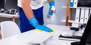 man cleaning the workplace in coronavirus pandemic